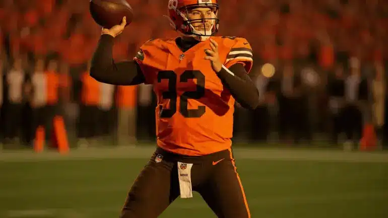 Cleveland Browns quarterback in throwing motion during NFL game action shot