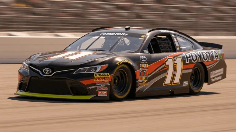 NASCAR Cup Series race car speeding through turn at Pocono Raceway in dramatic action shot