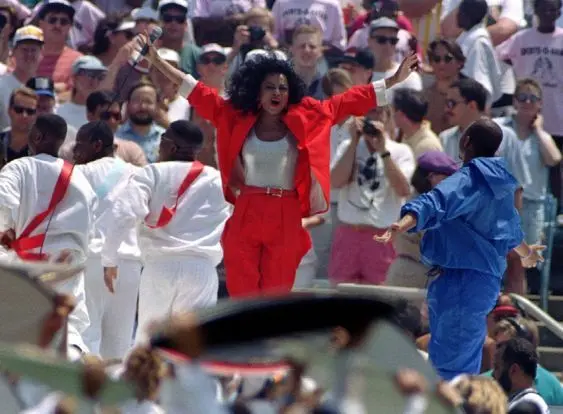 Diana Ross performing at the 1994 World Cup opening ceremony in a red outfit.
