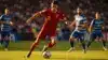 Spanish forward cutting inside against Uruguay defense during World Cup match action