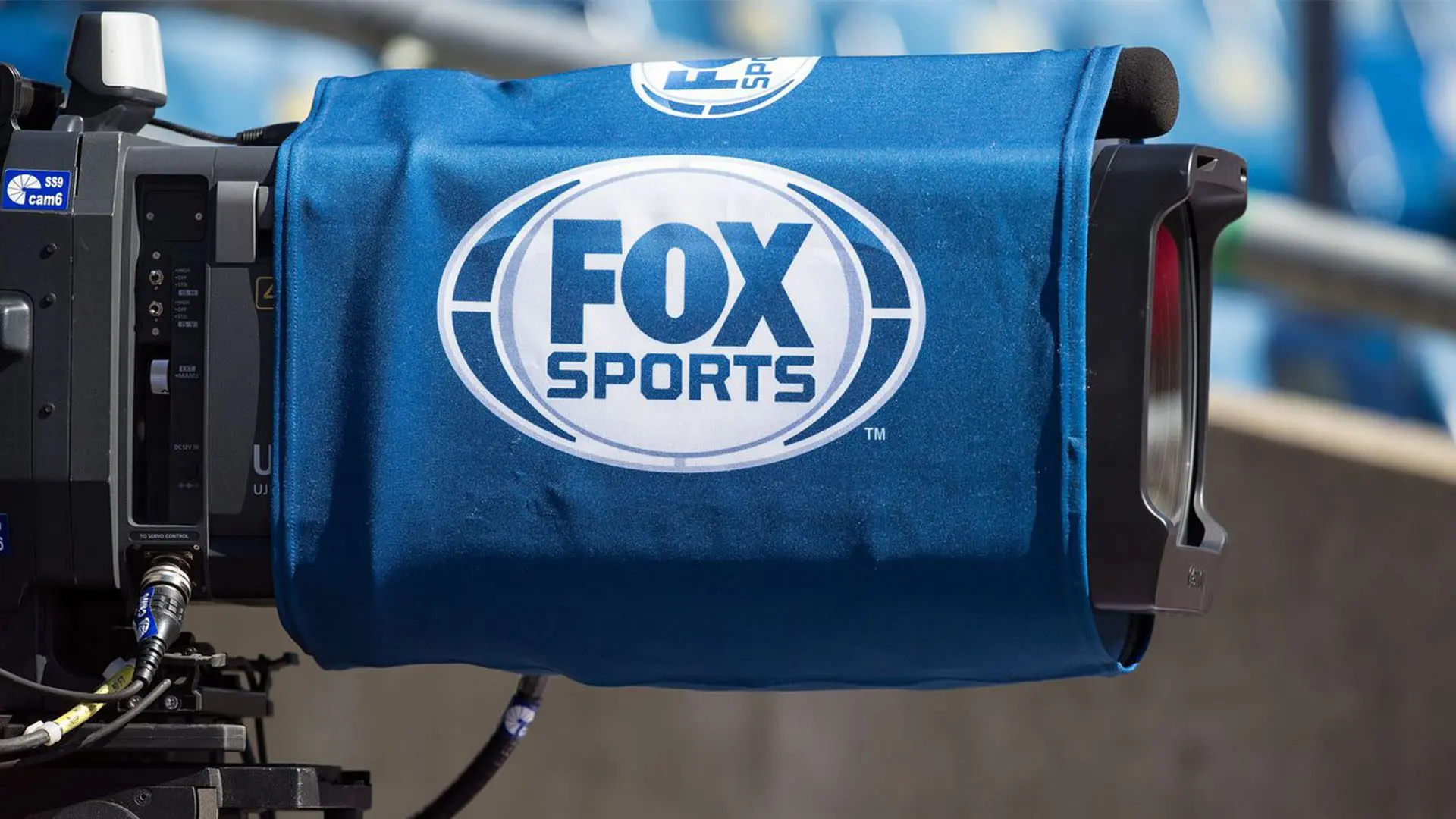 Close-up of a Fox Sports television broadcast camera at a sports event.