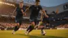 French soccer players in navy uniforms executing fast attacking play at Lincoln Financial Field