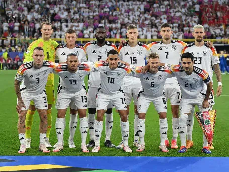 Germany national football team lineup posing for a group photo on the field.