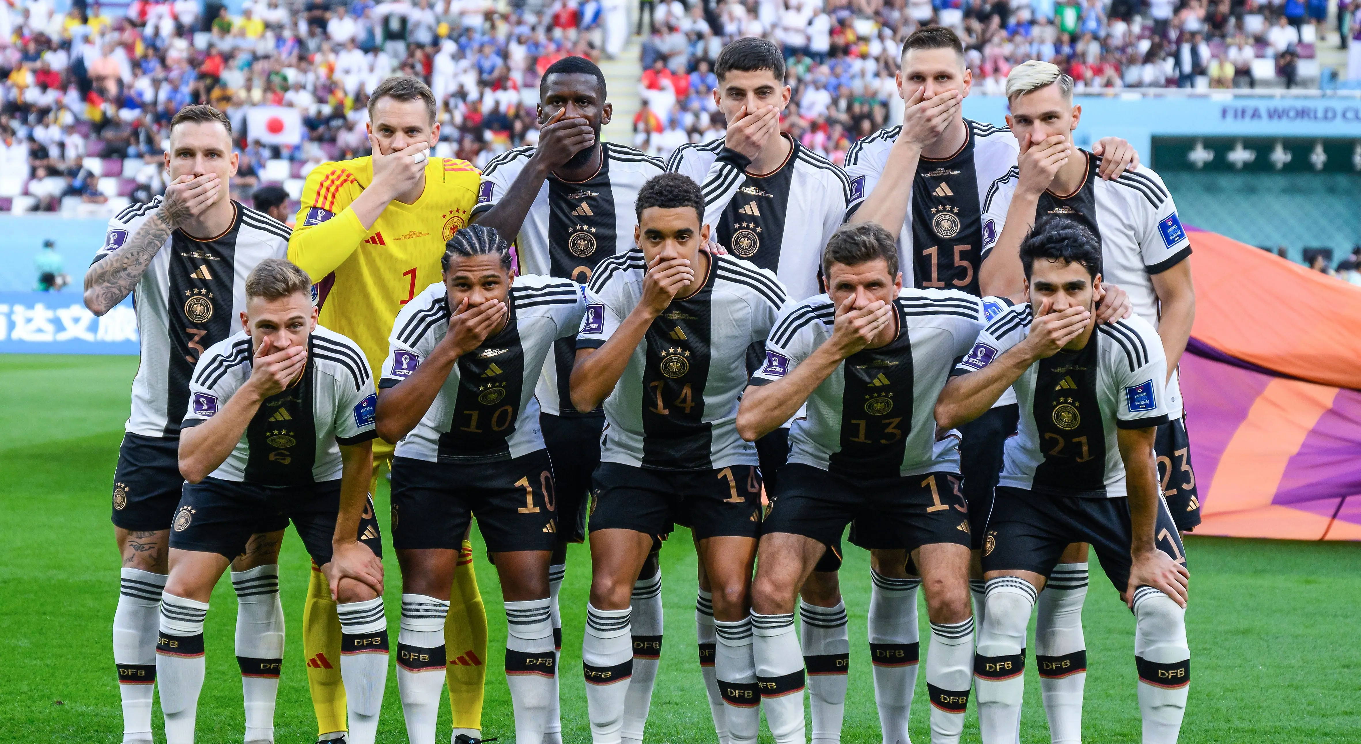 Germany national football team poses with hands on mouths at World Cup 2022.