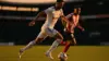 Germany player dribbling soccer ball against Paraguay defender at Gillette Stadium World Cup match