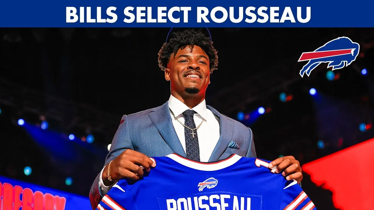 Gregory Rousseau holding a Buffalo Bills jersey during the draft.