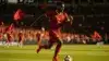 Achraf Hakimi sprinting with ball in Morocco jersey during World Cup match at stadium