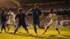 France soccer team attacking during World Cup match with multiple players pressuring defense in penalty area