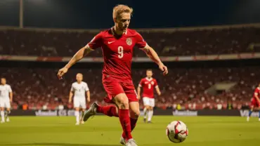 Norwegian striker in red kit shoots on goal during intense World Cup match at stadium