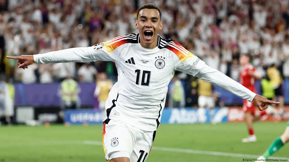 Jamal Musiala celebrating in Germany's football kit during a match.