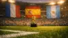 World Cup trophy on stadium pitch with France, Spain, and Argentina flags in stands at sunset