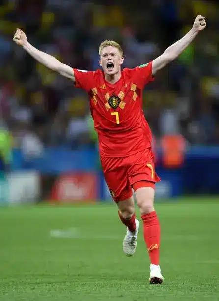 Kevin De Bruyne celebrating in Belgium national football team kit during a match.