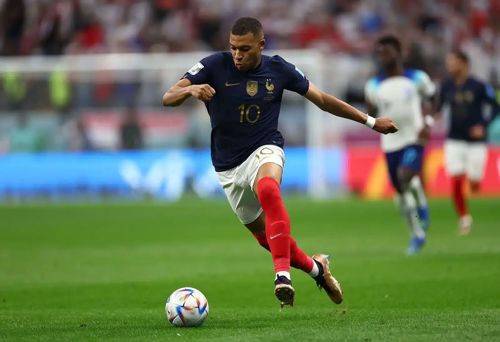 Kylian Mbappe of France dribbling the ball during a football match.