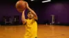 Basketball player shooting during Lakers pre-draft workout in professional training facility