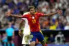 Lamine Yamal celebrating during a Spain football match, wearing the national team jersey.