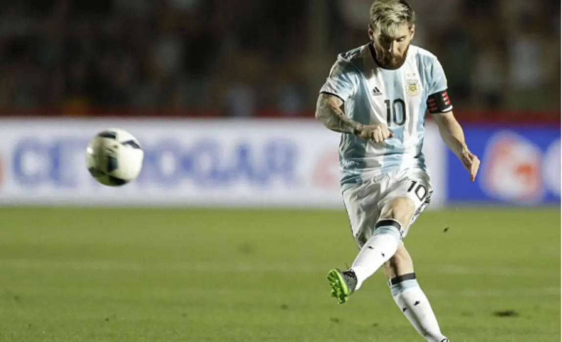 Lionel Messi striking a free kick for Argentina during a match.