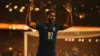 French soccer player celebrating goal in stadium during World Cup match