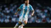 Lionel Messi in Argentina jersey controlling soccer ball during World Cup match action shot