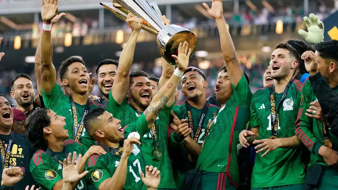 Mexico national soccer team celebrating with the Gold Cup trophy.