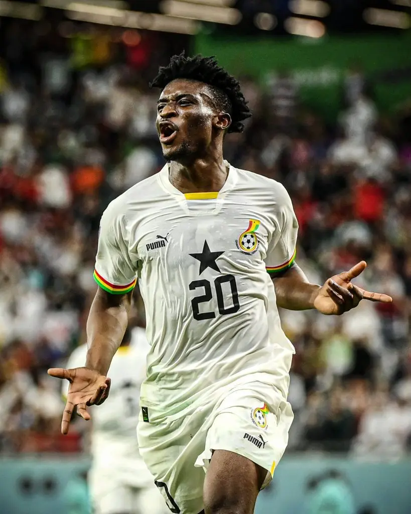 Mohammed Kudus of Ghana celebrating after scoring a goal in national team kit.
