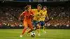 Netherlands vs Sweden World Cup match action with players competing for the ball in orange and yellow jerseys