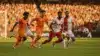 Netherlands soccer team attacking Tunisia's goal during World Cup 2026 Group F match in orange jerseys