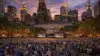 Aerial view of packed Bryant Park NYC watch party with Manhattan skyline at dusk