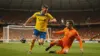 Sweden striker shooting on goal against Netherlands defender in World Cup 2026 indoor stadium match