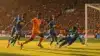 Ivory Coast soccer players attacking against Curacao in intense World Cup match action