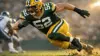 Green Bay Packers edge rusher in explosive pass-rush stance during NFL game action
