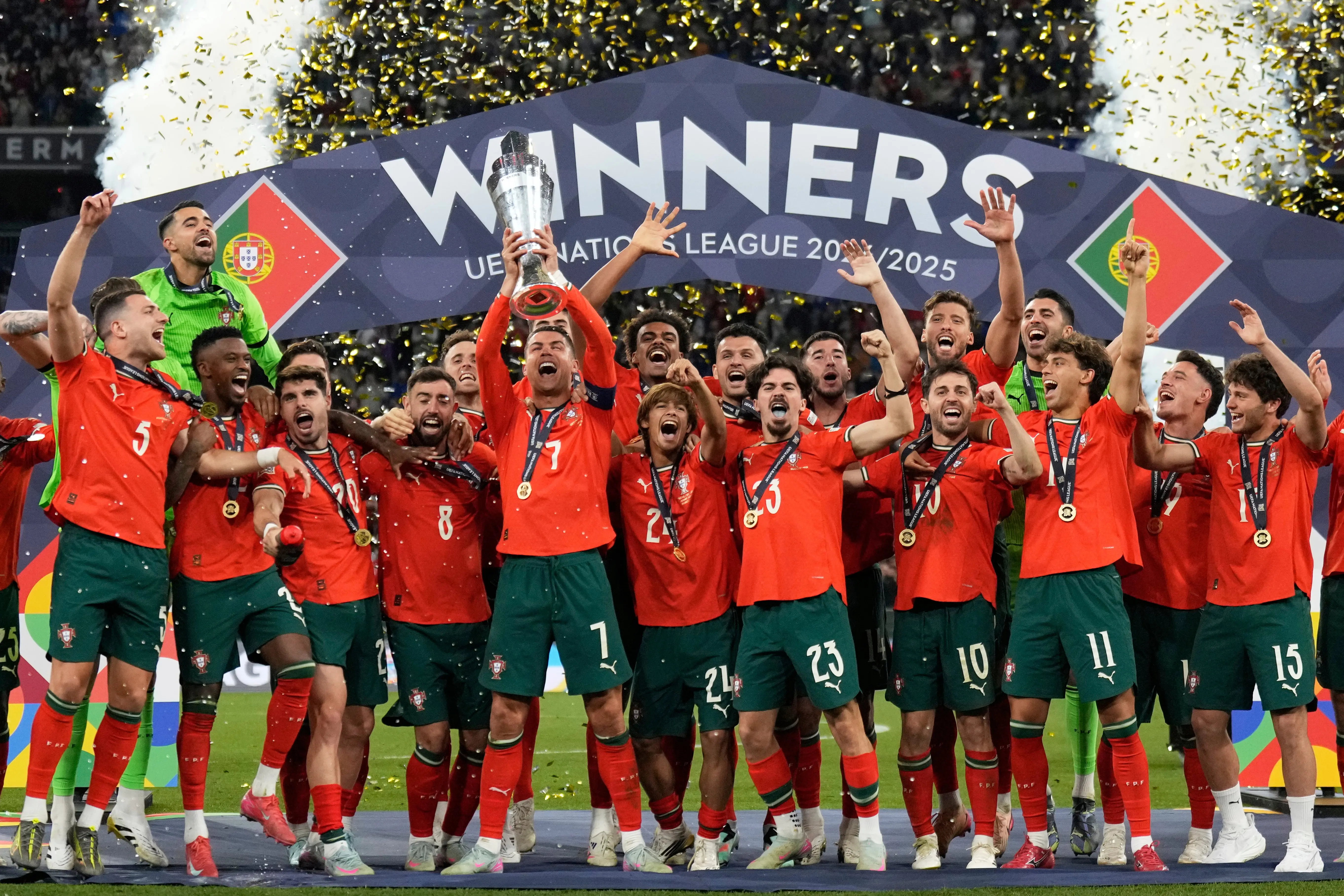 Portugal national football team celebrating UEFA Nations League victory with trophy.