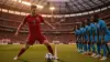 Portugal player in red jersey facing DR Congo defenders at NRG Stadium during 2026 FIFA World Cup match