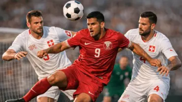 Qatar and Switzerland players competing for the ball during World Cup soccer match