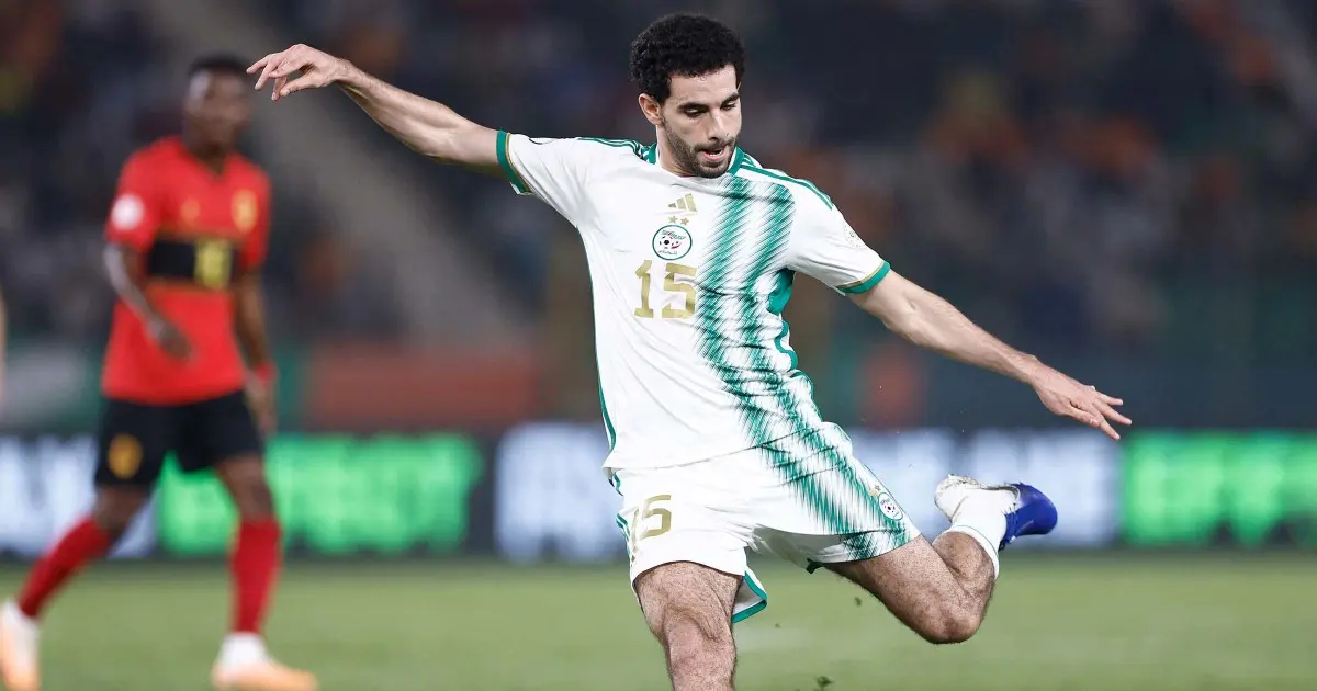 Rayan Ait-Nouri in action wearing Algeria national team jersey, playing during a match.