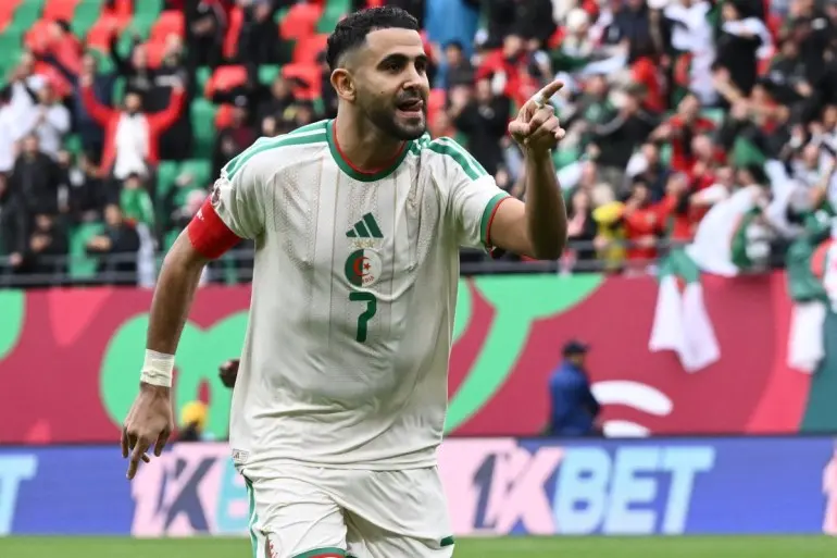 Riyad Mahrez celebrating during a match for the Algeria national team.
