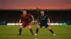 Morocco and Scotland national soccer teams competing in a World Cup match under stadium lights