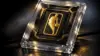 Premium NBA trading card in protective case with gold Logoman patch under dramatic studio lighting