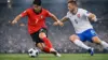 South Korea player in red jersey competing against Czech Republic defender in World Cup match