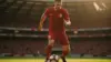Spain national team player controlling soccer ball in stadium during World Cup match action