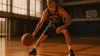 Spanish basketball guard practicing ball-handling on European court with dramatic lighting