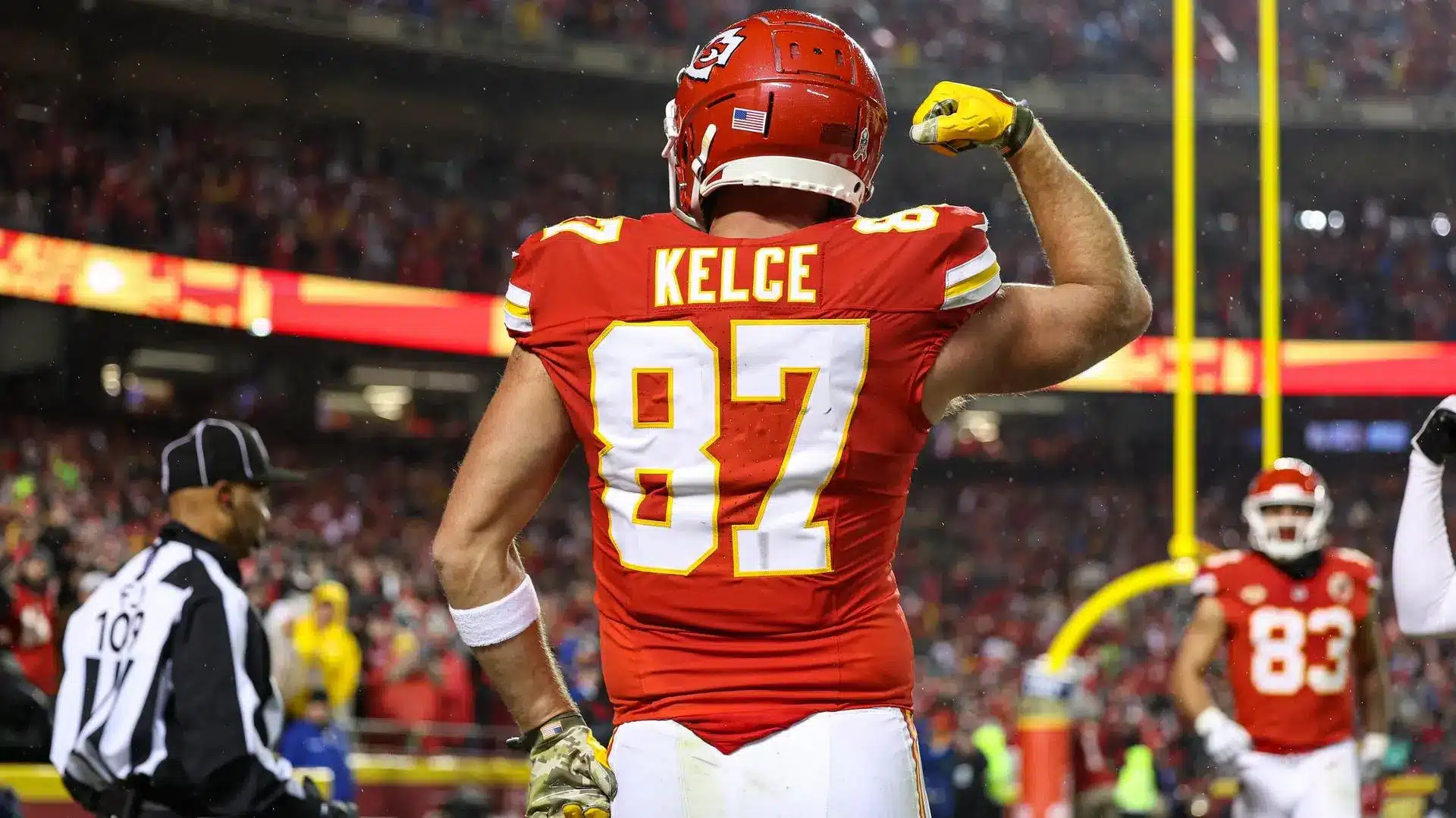 Travis Kelce celebrating in his Kansas City Chiefs uniform during a game.