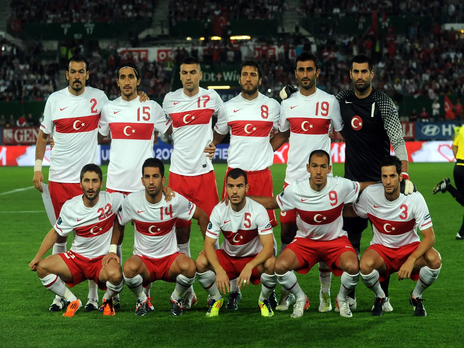 Turkey national football team posing for a team photo on the field.