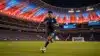 USA soccer player attacking at SoFi Stadium during World Cup 2026 match under illuminated roof