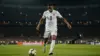 USA soccer player preparing to score during nighttime World Cup match at stadium