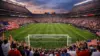 Packed American soccer stadium with fans in red white and blue during World Cup match