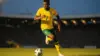 Vinícius Júnior in Brazil yellow jersey sprinting with ball during World Cup match