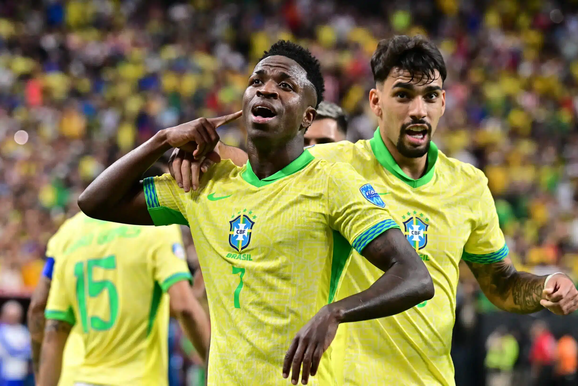 Vinicius Junior celebrating a goal for Brazil during a soccer match.