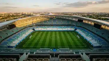 Aerial view of empty World Cup stadium at golden hour showing strategic field layout