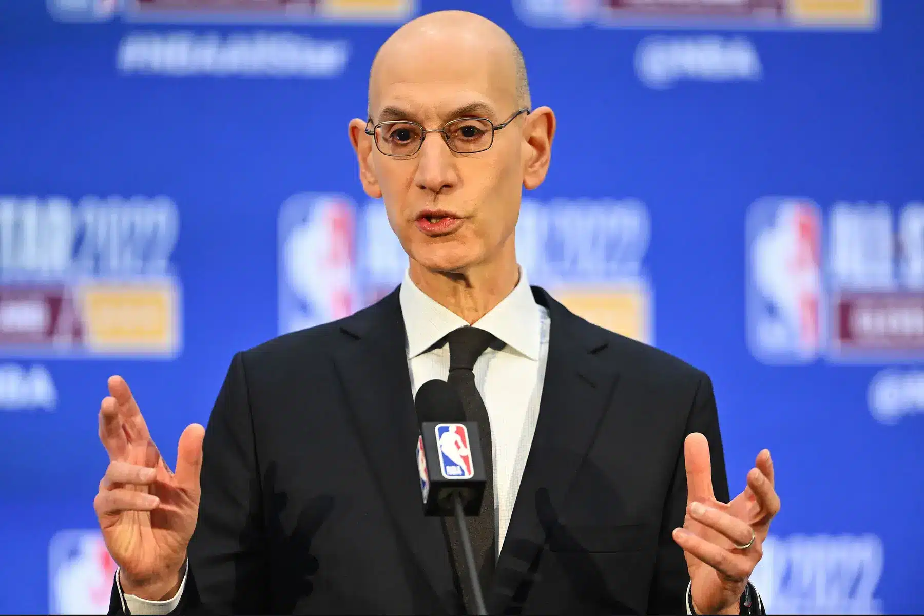 Adam Silver speaking at a podium during the NBA All-Star 2022 event.