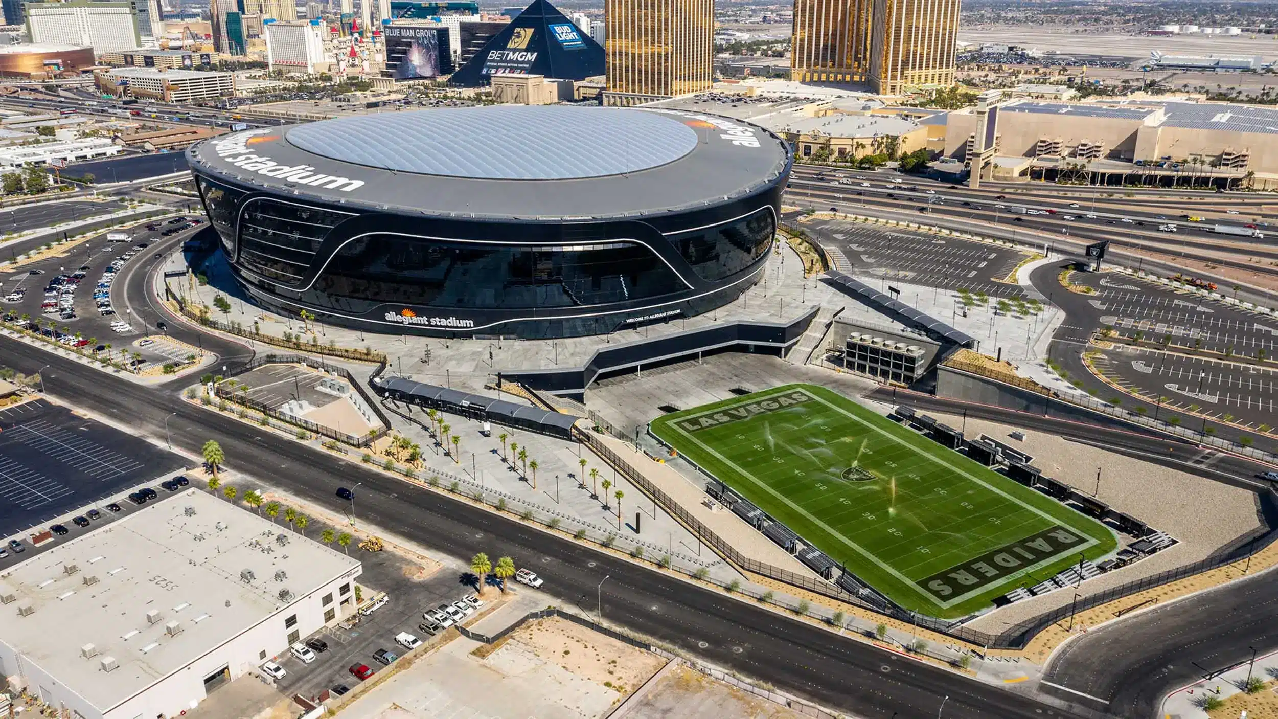Aerial view of Allegiant Stadium in Las Vegas, featuring its modern architecture and surroundings.